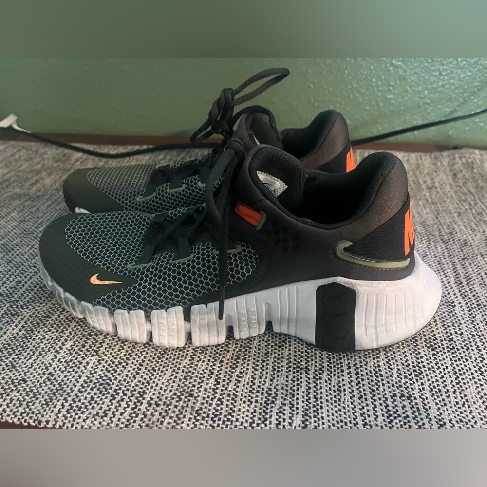 Nike Women's Black and White Sneakers with Orange Accents